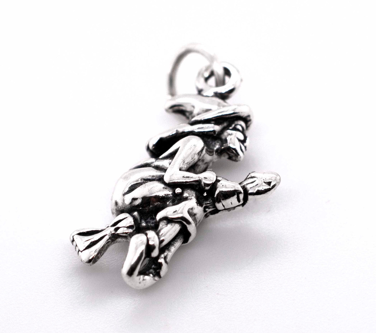 A Witch on a Broomstick Charm by Super Silver, in silver.
