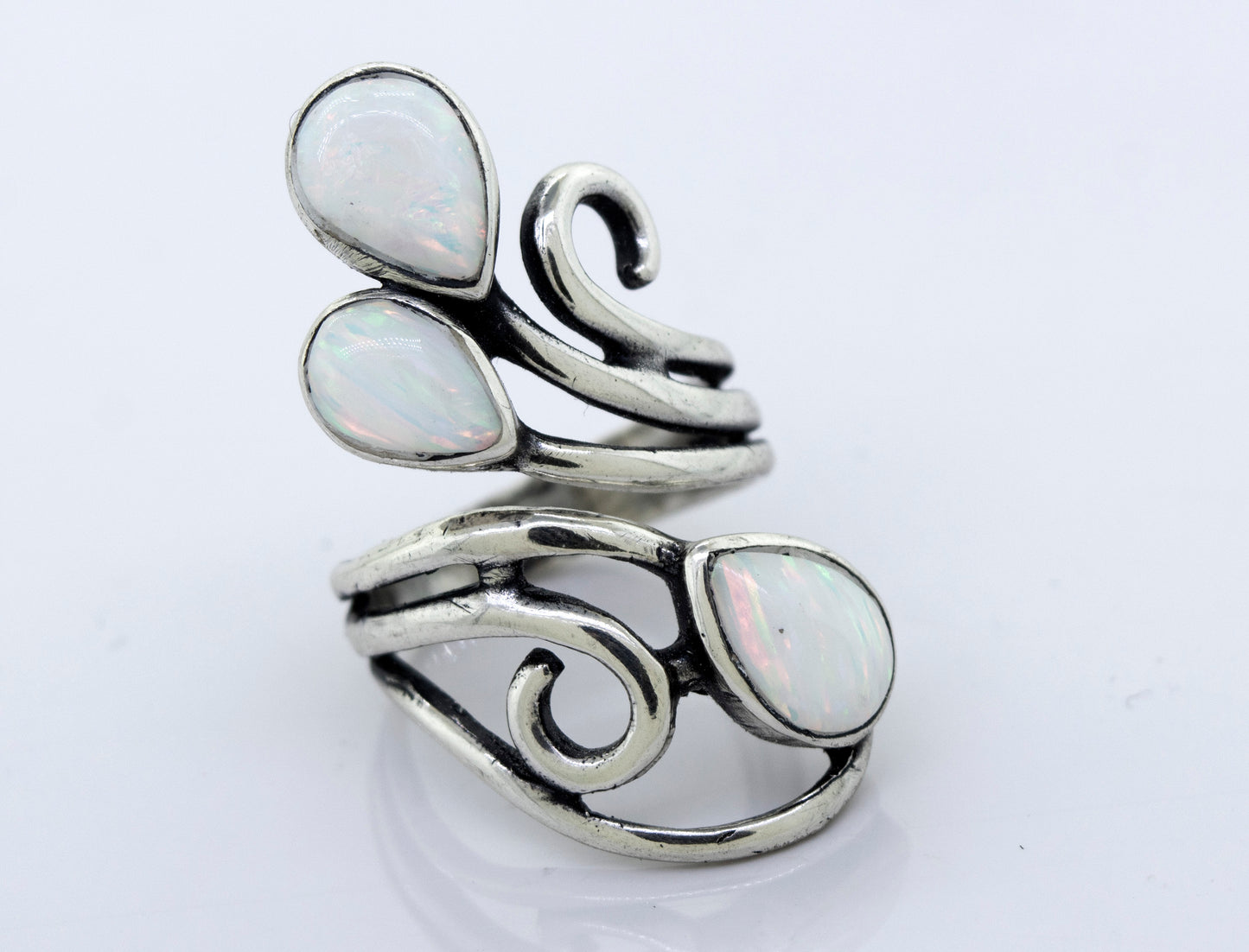 
                  
                    A Super Silver Stunning Wrap-Around Opal Ring, handcrafted with swirls in silver.
                  
                