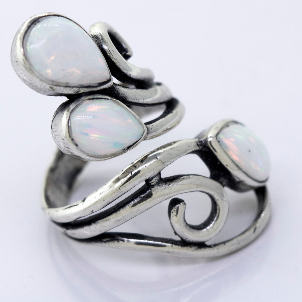 
                  
                    A Super Silver Stunning Wrap-Around Opal Ring handcrafted with opal stones, featuring elegant swirls design.
                  
                
