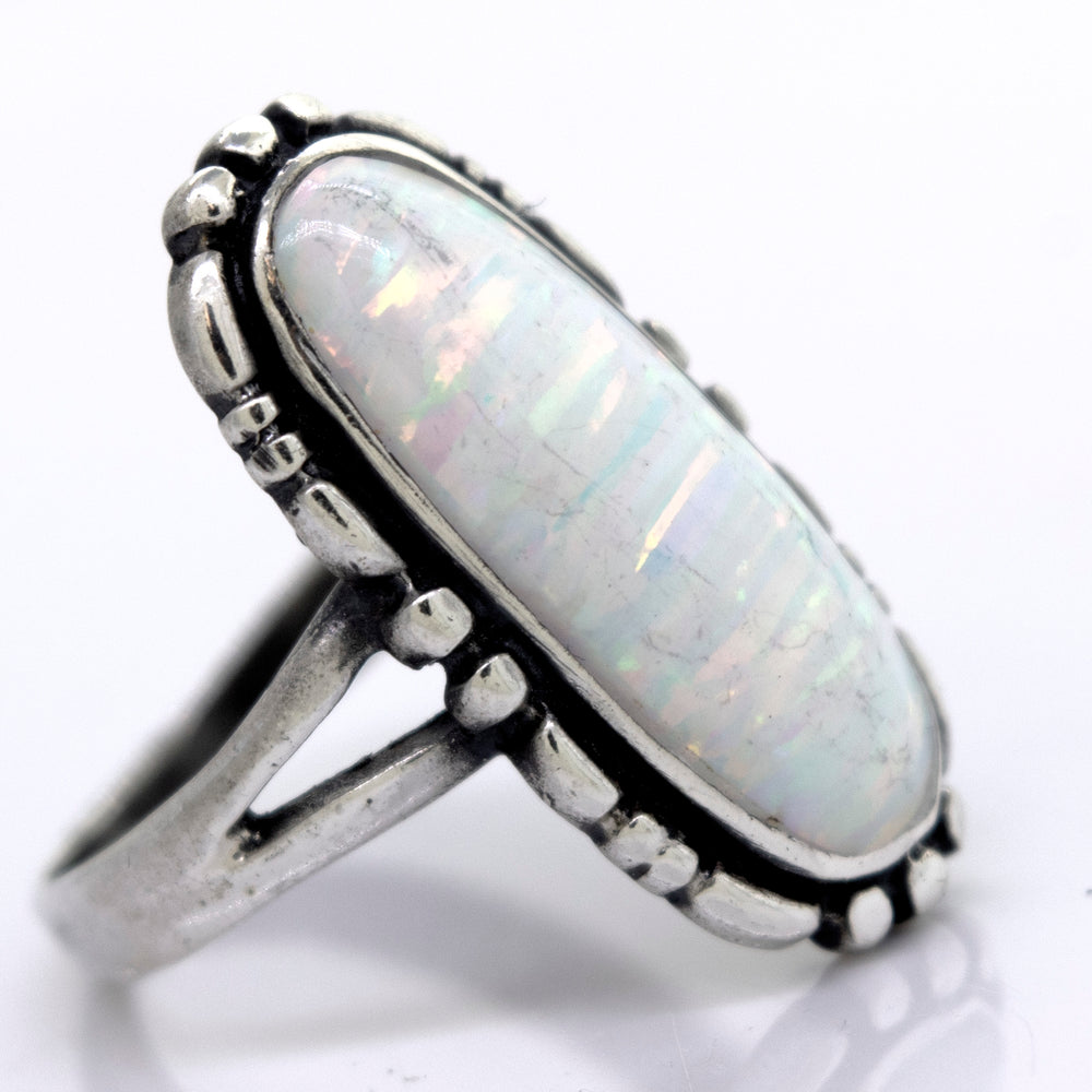 
                  
                    A handcrafted American Made Oval Opal Ring with a southwestern-styled design, displayed on a white surface. (Brand: Super Silver)
                  
                