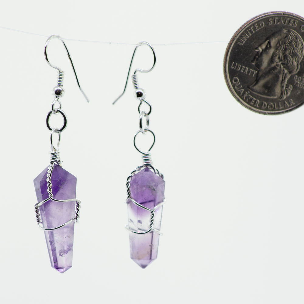 
                  
                    Genuine Wire Wrapped Stone earrings with a dime hanging from them, perfect for everyday wear. The brand name is Super Silver.
                  
                