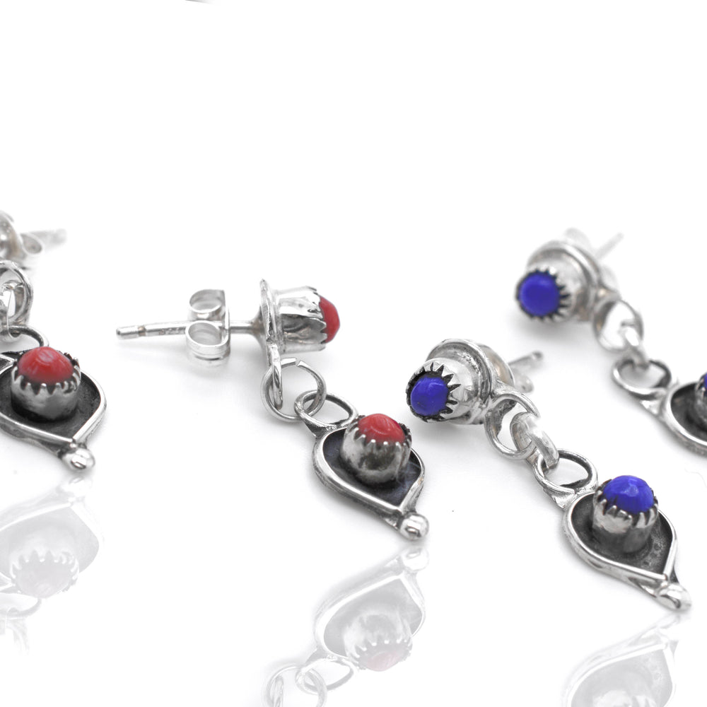 Handmade Super Silver Zuni earrings crafted from .925 sterling silver with lapis and coral stones.