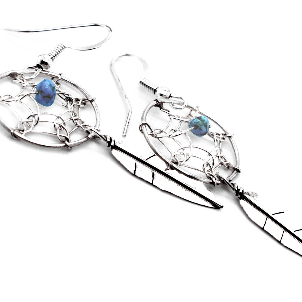 
                  
                    A pair of Super Silver Zuni Dreamcatcher Earrings with Natural Stone Bead.
                  
                