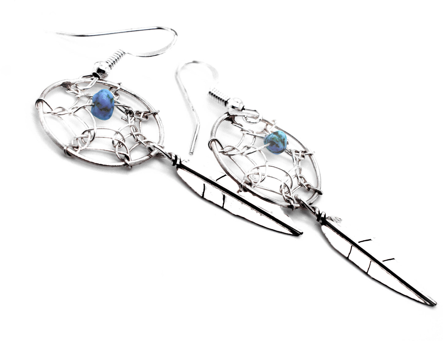 
                  
                    A pair of Super Silver Zuni Dreamcatcher Earrings with Natural Stone Bead.
                  
                